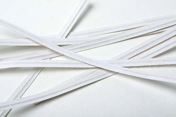4 white plastic twist ties