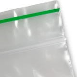 3 x 4 Biodegradable Reclosable 2 Mil Zipper Bag Close Up of Greenline on Lip of Bag