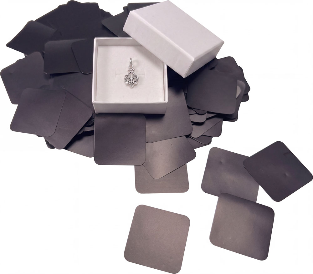 Silver Keepsake surrounded by Intercept Anti-tarnish paper tabs - 1x1 100 Pack
