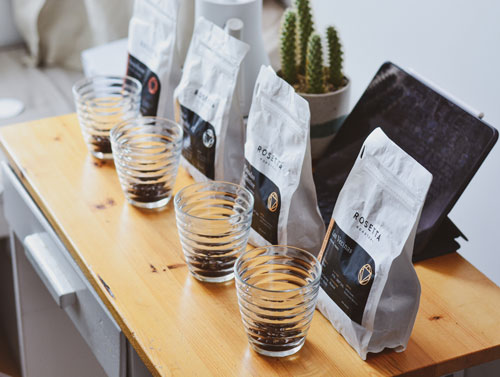 Custom printed coffee bags on wood table