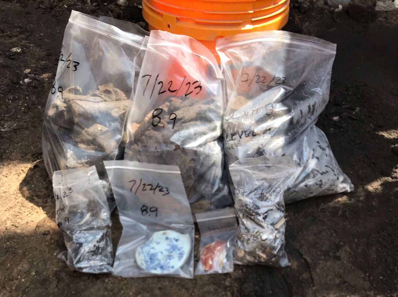 12x15 bags full of material from 1 unit, 2 smaller bags with individual fragile ceramic items (artifacts 5 and 2 photos), the 2 smaller outlying bags have small pieces of ceramics and glass