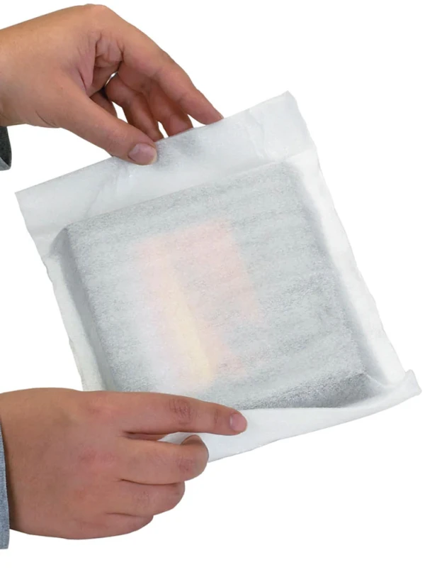Custom Cohesive Foam Packaging Hands Making Custom Cohesive Foam Packaging