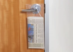 Doorknob Bags Plastic Doorknob Bags hanging from door handle with newspaper