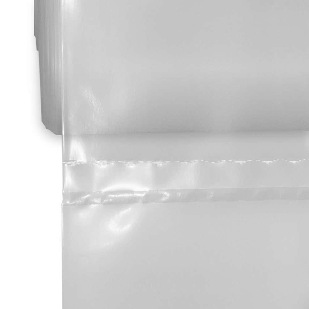 Close up of Bottom Seal and Perforation of 55 Gallon Drum Liners - 3 Mil Clear Plastic 38 x 63 On Rolls