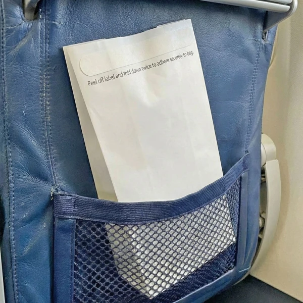 4.5 x 2.5 x 8.5 Air Sickness Emesis Bags with Adhesive Seal 4.5 x 2.5 x 8.5 Air Sickness Emesis Bags with Adhesive Seal in the Back of a Commercial Airline Seat