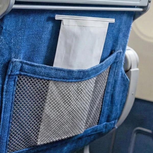 4.5 x 2.5 x 8.5 Air Sickness Emesis Bags with Wire Tie Seal in Airplane Seat Back 4.5 x 2.5 x 8.5 Air Sickness Emesis Bags with Wire Tie Seal in Airplane Seat Back