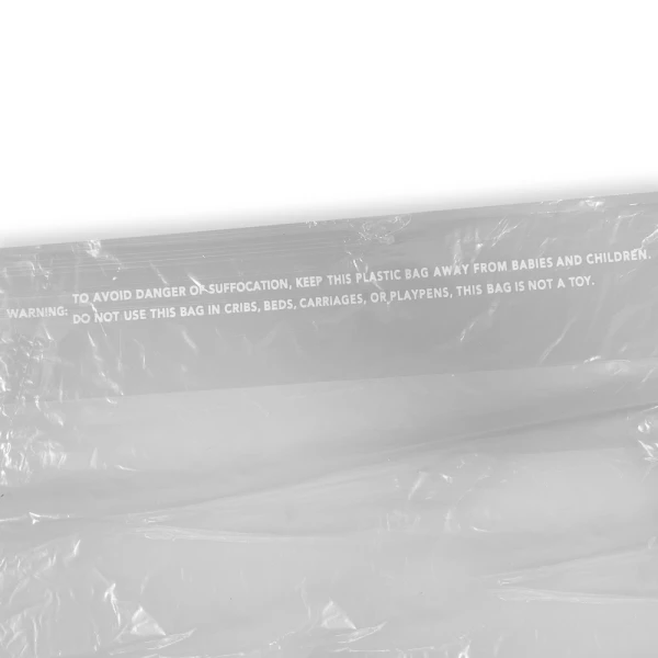 21 x 4 x 38 Clear Dry Cleaning Bag Suffocation Warning Close up of 21x4x38 .5 Mil Clear Plastic Garment Bags and Dry Cleaning Bags on Rolls for Slacks and Shirts Suffocation Warning