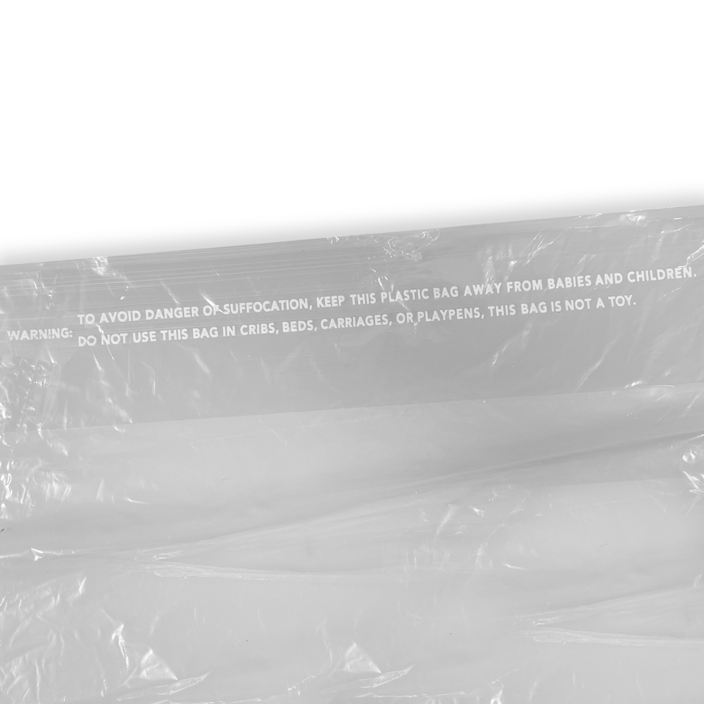 Close up of 21x4x38 .5 Mil Clear Plastic Garment Bags and Dry Cleaning Bags on Rolls for Slacks and Shirts Suffocation Warning