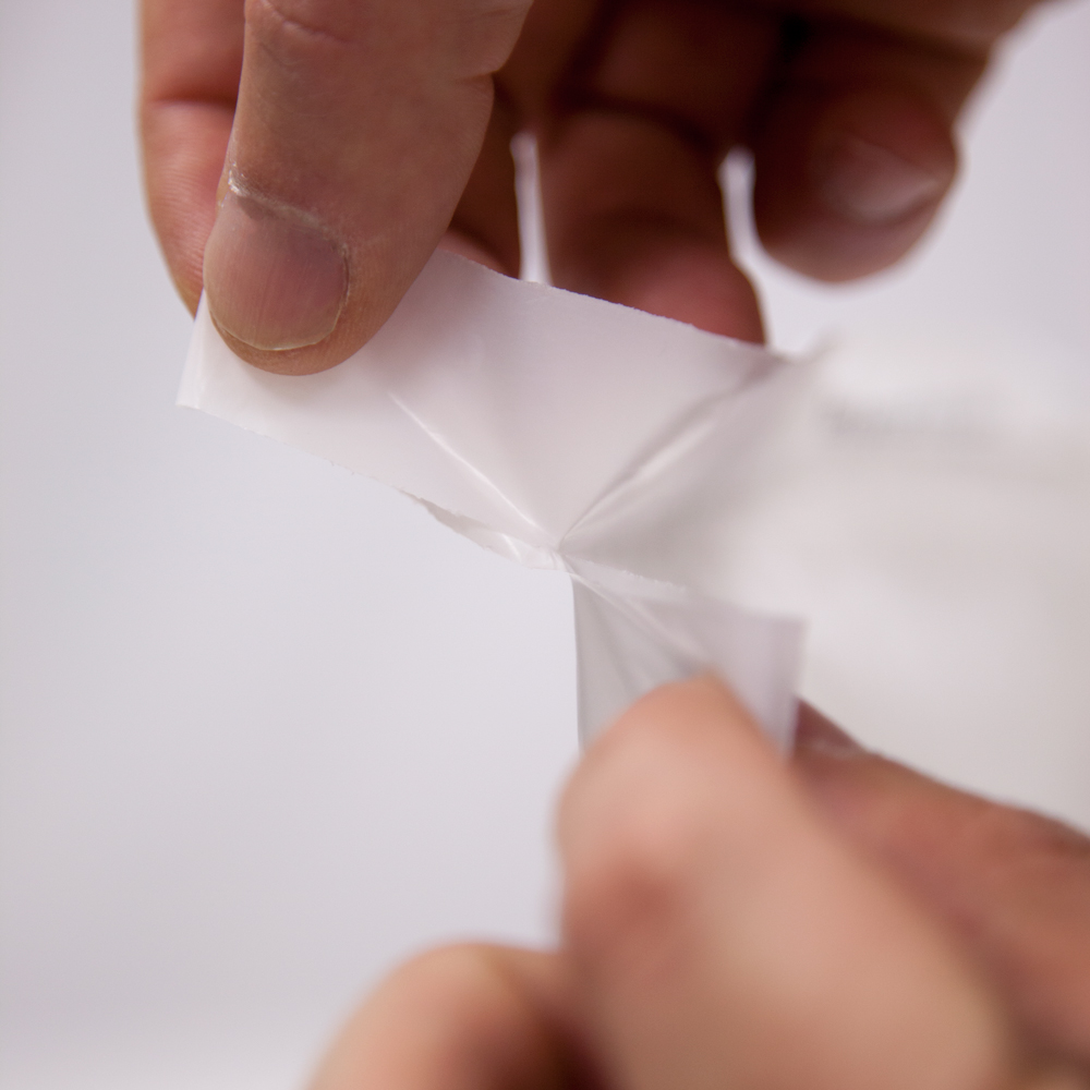 Removing Perforated Strip on 14 x 24 1.25 Mil Plastic Laundry Bags - Eco Friendly