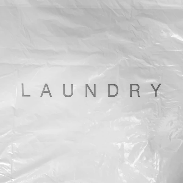 Biodegradable Drawstring Plastic Laundry Bag Laundry Print Close up of 18 x 19 1.25 Mil Earth Friendly Hotel Laundry Bag Laundry Print