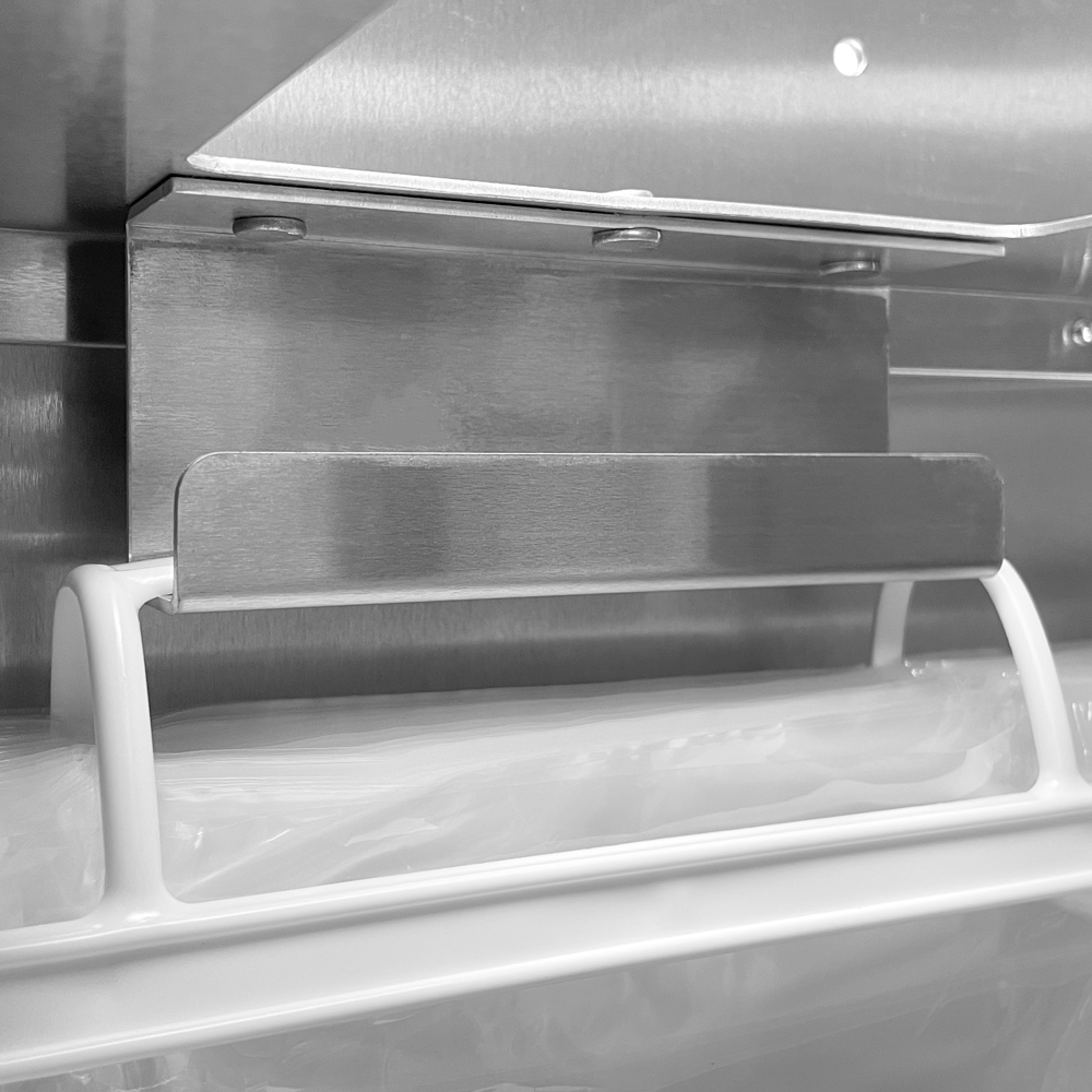 Close up of 8lb - 10 lbs. Ice Bagger Dispenser Inner Bracket with Plastic Wicket Bags