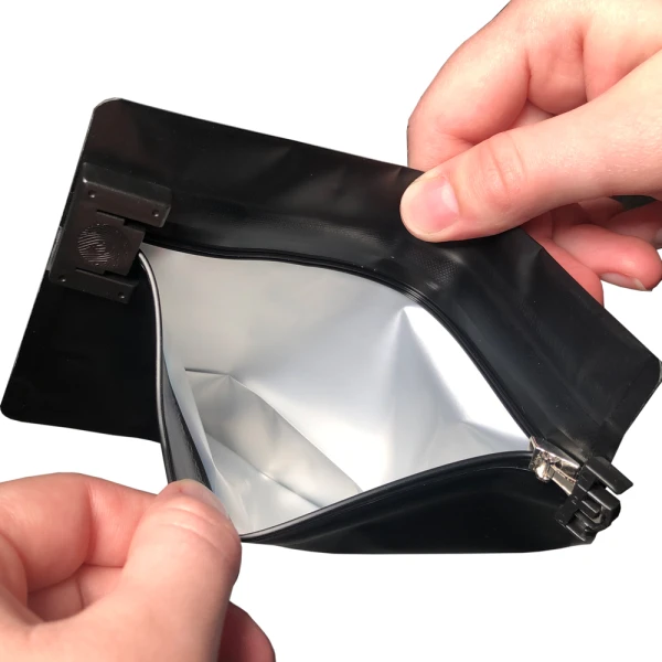 6.69 x 4 Child Resistant Exit Bags Black 6.69 x 4 Child Resistant Exit Bags Hands Holding Bag Open
