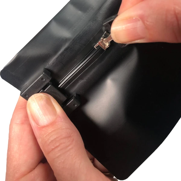 6.69 x 4 Child Resistant Exit Bags Black 6.69 x 4 Child Resistant Exit Bags Fingers Pulling Zipper Open