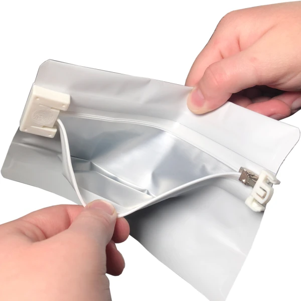 Open 6.69 x 4 Child Proof Exit Bags White 6.69 x 4 Child Resistant Exit Bags Hands Holding Bag Open Being Opened using Two Hands