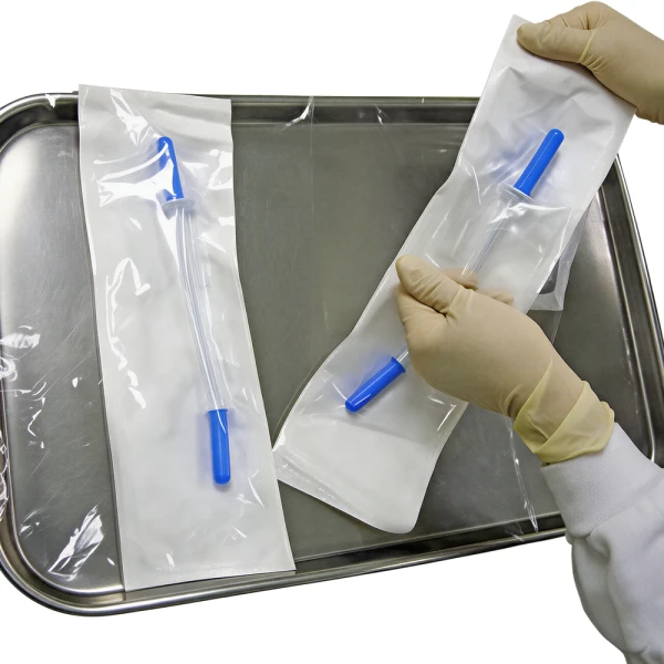1. Firmly grasp the decanter’s container pouch at the end and peel open to expose the spiked end of the Bag Decanter. Medical professional removing IV Decanter from Sterile Pouch