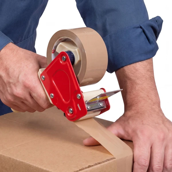 2 Inch x 55 yds Tan PVC Natural Rubber Applied to Box Tan 2 x 55 yds 2.1 mil PVC Natural Rubber Tape being Taped to Box