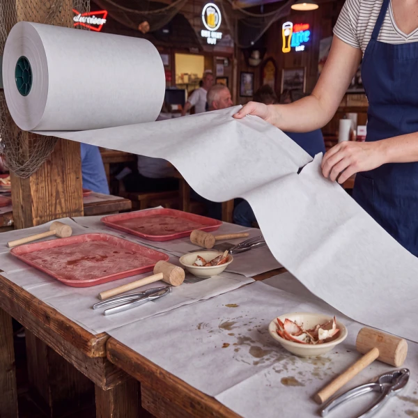 18 x 1440 Paper Newsprint Roll at Crabshack Using 18 x 1440 Newsprint Rolls - 100% Recycled Paper to cover a table at a Crabshack