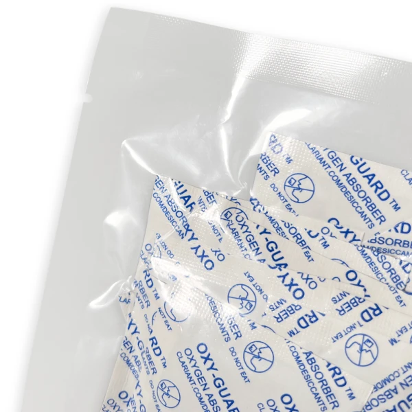 Oxy-Guard Oxygen Absorbing Packets 100cc Tear Notch Close up of Oxy-Guard Oxygen Absorbing Packets 100cc Tear Notch