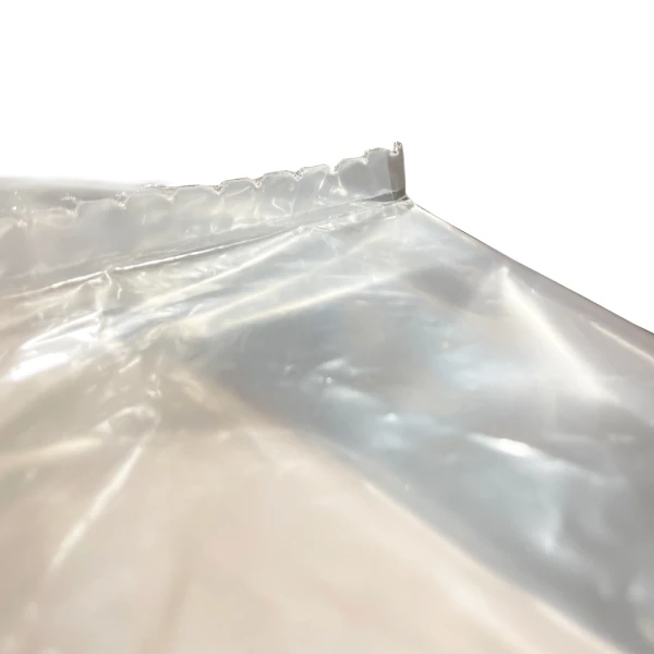 48 x 42 x 48 1 Mil Clear Pallet Cover Perforation on Seal 48 x 42 x 48 1 Mil Clear Pallet Cover Close Up of Perforation on Seal