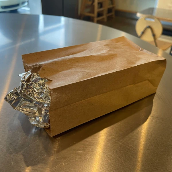 30 lb. Kraft #2 Grocery Bags 30 lb. Kraft #2 Grocery Bags Holding Wrapped Foil Sandwich