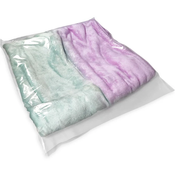 28 x 32 2 Mil Flat Poly Bag Protecting Product Folded Green and Pink Blanket in 28 x 32 2 Mil Flat Poly Bag