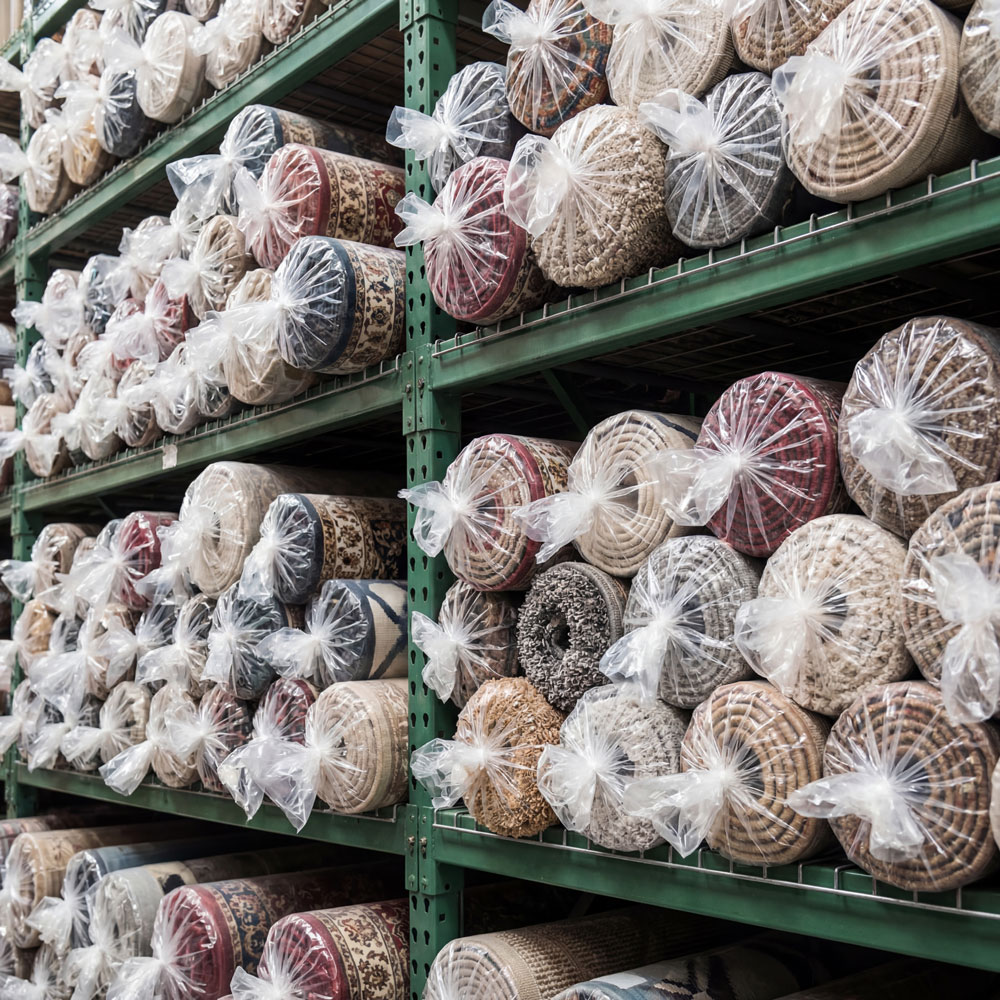 4 Mil 48 x 48 Poly Bags Protecting Rolls in a Warehouse of Rugs