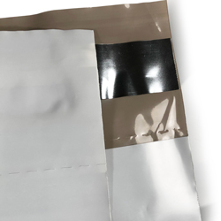 12 x 15.5 Poly Mailers with Tear Perforation Tape and Perforation Small Quantity Small Quantity 12 x 15.5 Poly Mailers with Tear Perforation Close Up of Tape and Perforation