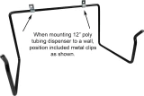 Position of metal clips when mounting 12 inch poly tubing dispenser to wall.