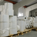 Clear Plastic Sheeting in stacked Rolls in Warehouse Ready for Delivery