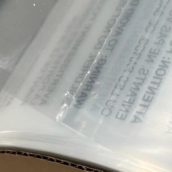 10 x 15 1.5 Mil Auto Bags with Suffocation Warning Perforation and Bottom Seal 10 x 15 1.5 Mil Pre-Opened Bags On Roll For Automated Bagging Perforatiuon and Bottom Seal