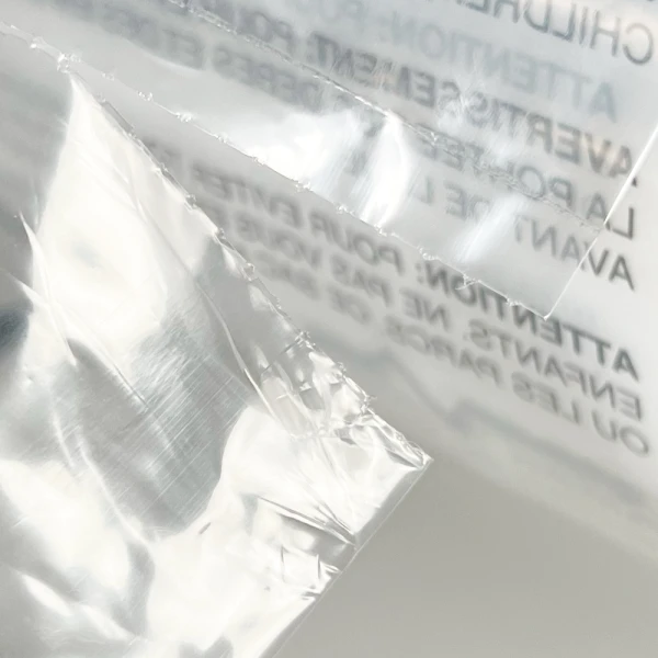 12 x 18 1.5 Mil Auto Bags with Suffocation Warning Perforation 12 x 18 1.5 Mil Pre-Opened Bags On Roll For Automated Bagging Perforation