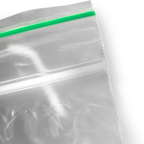 2 x 3 2 Mil Minigrip Greenline Biodegradable Reclosable Bags Zipper and GreenLine Close up of 2 x 3 2 Mil Minigrip Greenline Biodegradable Reclosable Zipper and GreenLine Along Top of Bag Lip