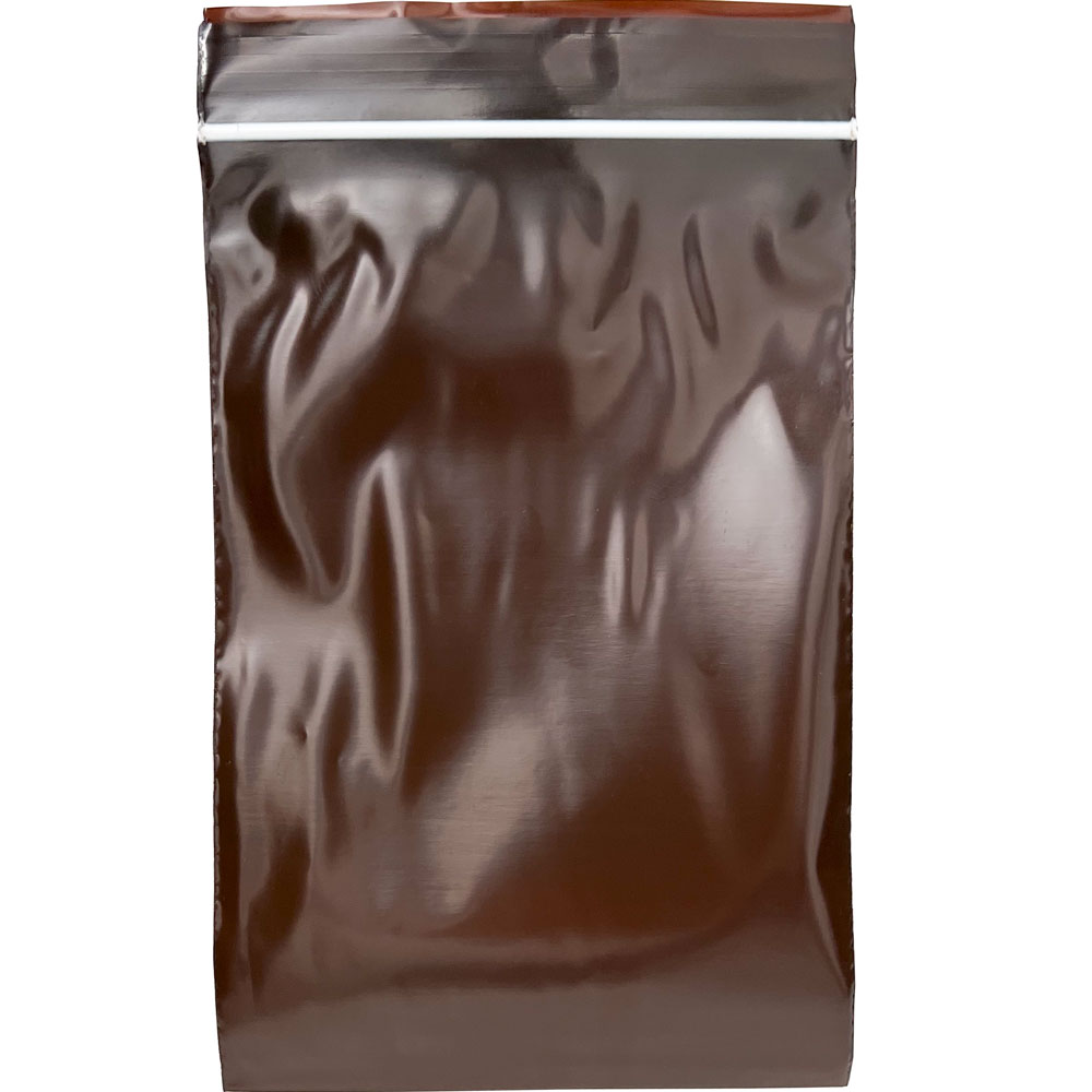 Front of Physical 4 x 6 3 Mil Minigrip Reclosable Amber UV Protective Bag with White Line Printed over Zipper