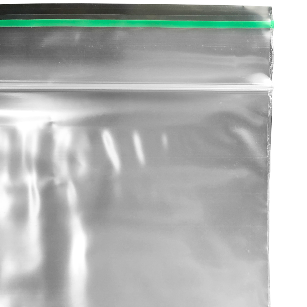 Close up of 4 x 6 2 Mil Minigrip Greenline Biodegradable Reclosable Bags Zipper and Green Line Lip