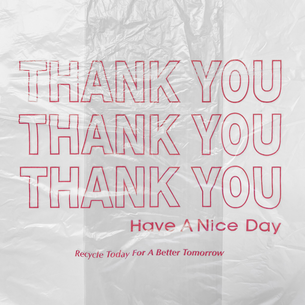 Close up of 11.5 x 6.5 x 21 Thank You Carry Out T-Shirt Bags 0.6 Mil Print on Front of Bag