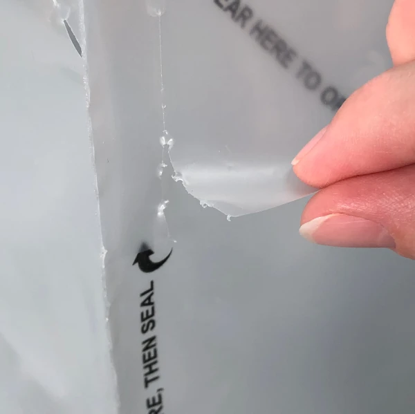 21 x 15 + 10 Tamper-Resistant Delivery Bag 21 x 15 + 10 Tamper-Resistant Delivery Bag Close Up of Torn Perforated Tear Flap
