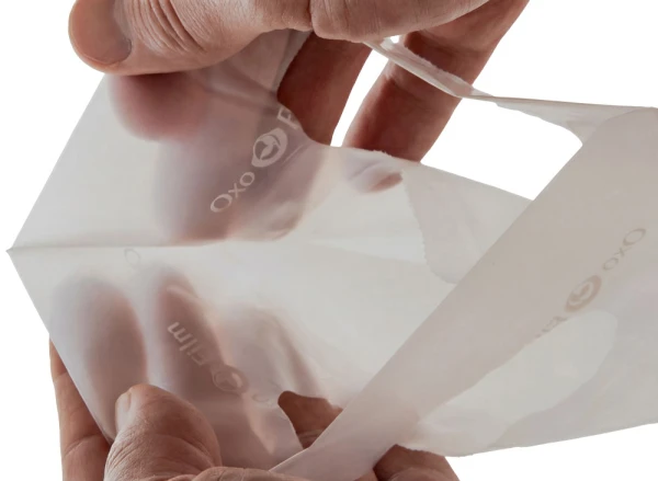 9 x 12 + 2 2.5 Mil Clear Frosted Eco Friendly Shopping Bags Die Cut Handle Die Cut Handle of a 9 x 12 + 2 2.5 Mil Clear Eco-Friendly Fold-Over Reinforced Die Cut Handle Bags