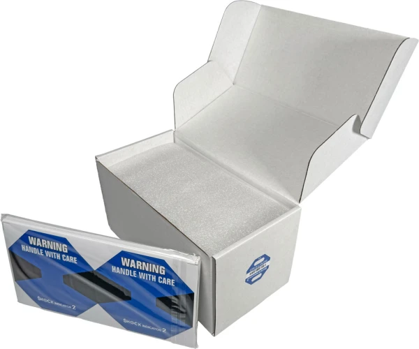15G Shock Indicator Label with Pack of Labels Pack of Labels sitting outside of Case of 15G Shock Label Indicator