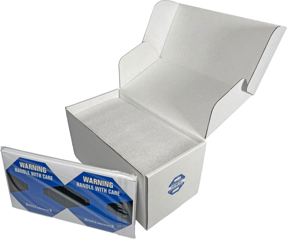 Pack of Labels sitting outside of Case of 15G Shock Label Indicator