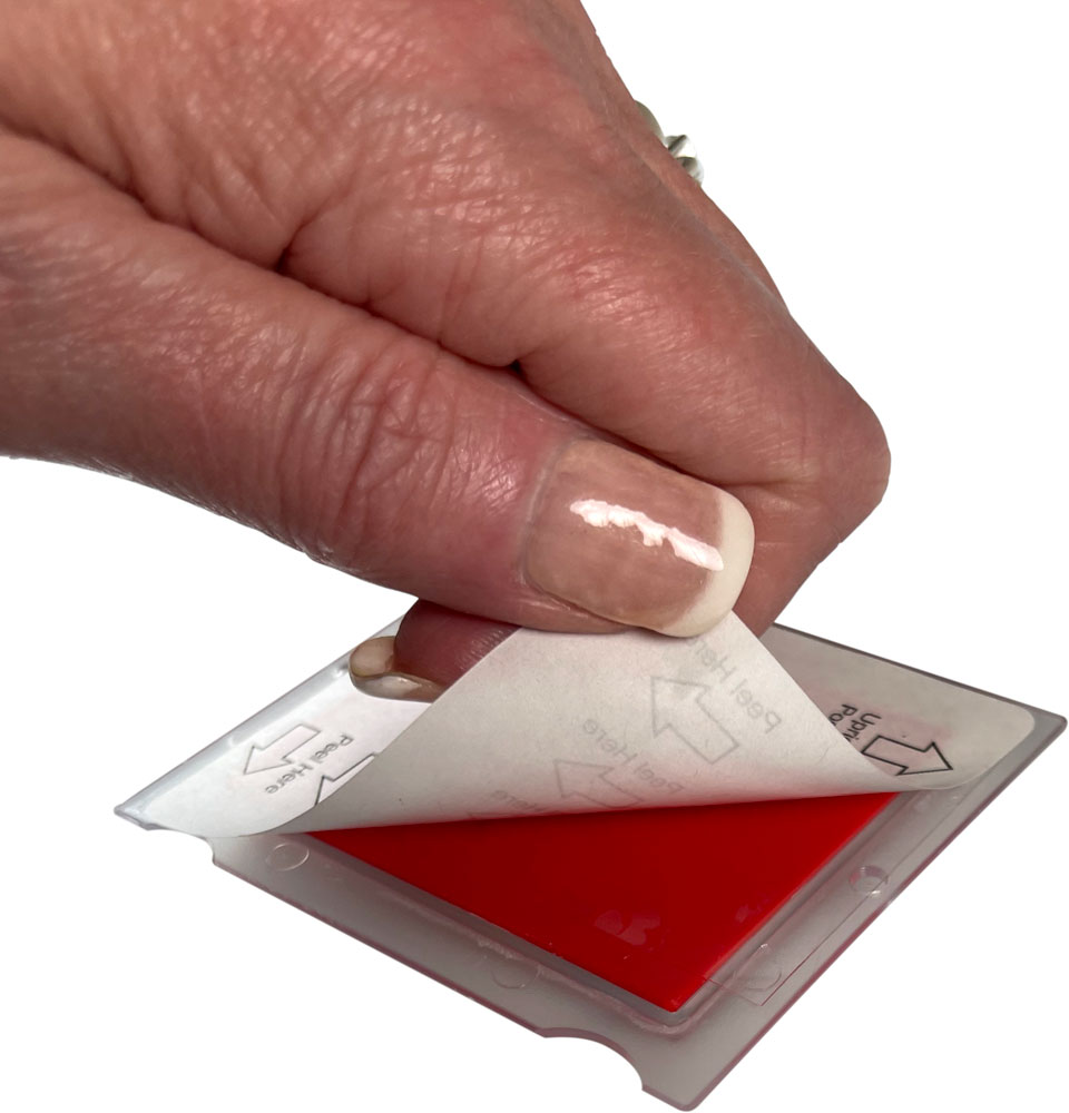 Tiltwatch XTR Adhesive Back Peeling Back with Woman's Hand