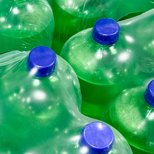20 Inches x 4200 Feet 2 mil Shrink Bundling Film Holding Green Plastic Soda Bottles Holding Green Plastic Soda Bottles Using 20 Inches x 4200 Feet .002 mil Heat Shrink Film