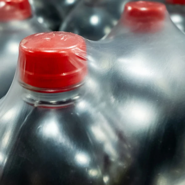 24 x 4200 2 mil Shrink Bundling Film Around Bottles Soda Bottles Being Secured around 24 Inches x 4200 Feet .002 mil Heat Shrink Film