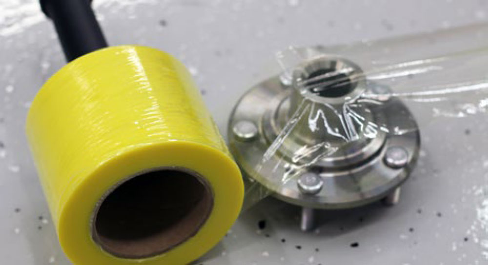 4 x 667' Stretch Film - Ferrous Yellow on Floor Covering Metal