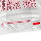 Close up of 6 x 3 x 12 Thank You Shopping Bags 0.65 Mil Thank You Print Suffocation Warning on Bottom Front of Bag