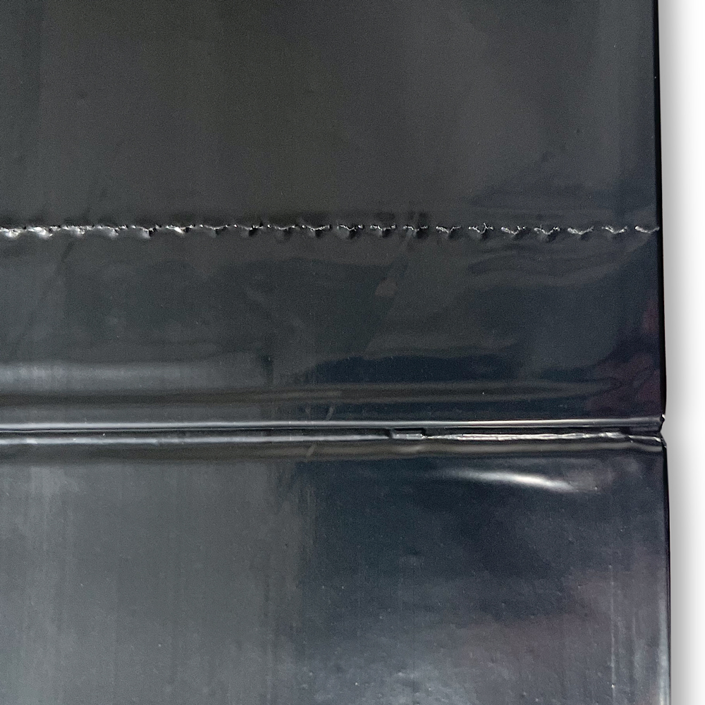 Perforation and Bottom Seal of 40-45 Gallon Black Repro Garbage Bags 40 x 46