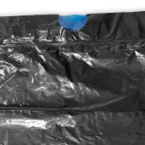 Close up of 44 Gallon Black Drawstring Trash Bags - 1.2 Mil Blue Draw Tape