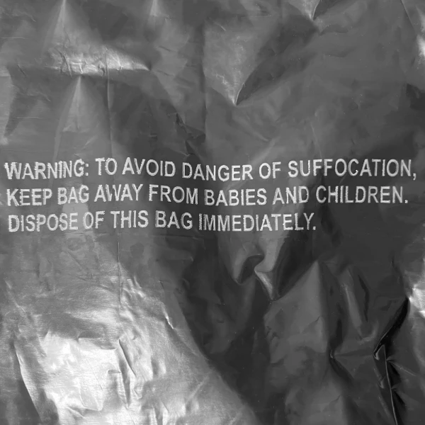 44 Gallon Black Drawstring Trash Bags - 1.2 Mil Suffocation Warning Print Close up of 44 Gallon Black Drawstring Trash Bags - 1.2 Mil Suffocation Warning Print