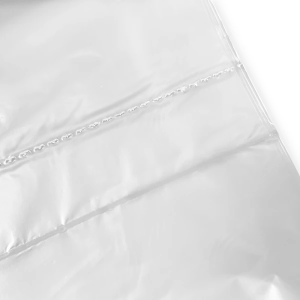 56 Gallon Regular Duty Trash Bags - 0.7 Mil - 100 per case Bottom Seal and Perforation Close up of 56 Gallon Regular Duty Trash Bags - 0.7 Mil - 100 per case Bottom Seal and Perforation