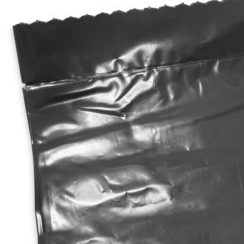 Close up of 56 Gallon Repro Trash Bags - 2 Mil - 100/case Bottom Seal and Perforation