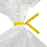 Close up of 4 Inch Yellow Paper Twist Ties Tied on Bag